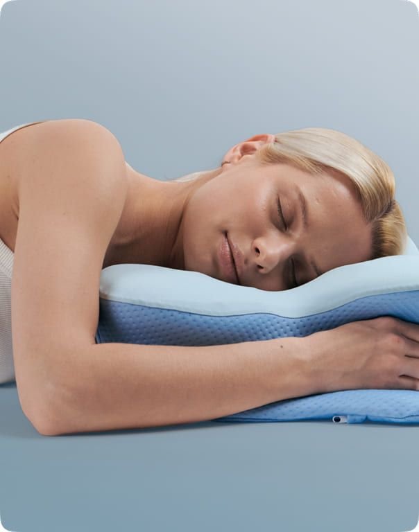 Stomach sleeper using the Derila Ergo pillow